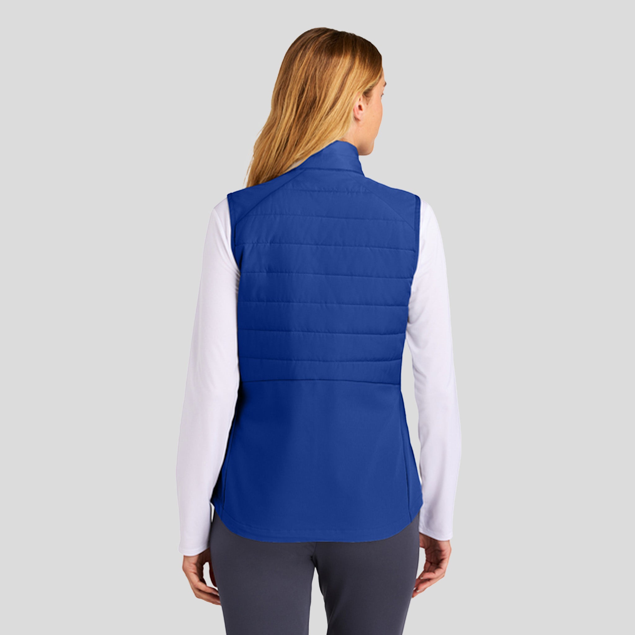 Womenโs Teknical Hybrid Vest | True Royal